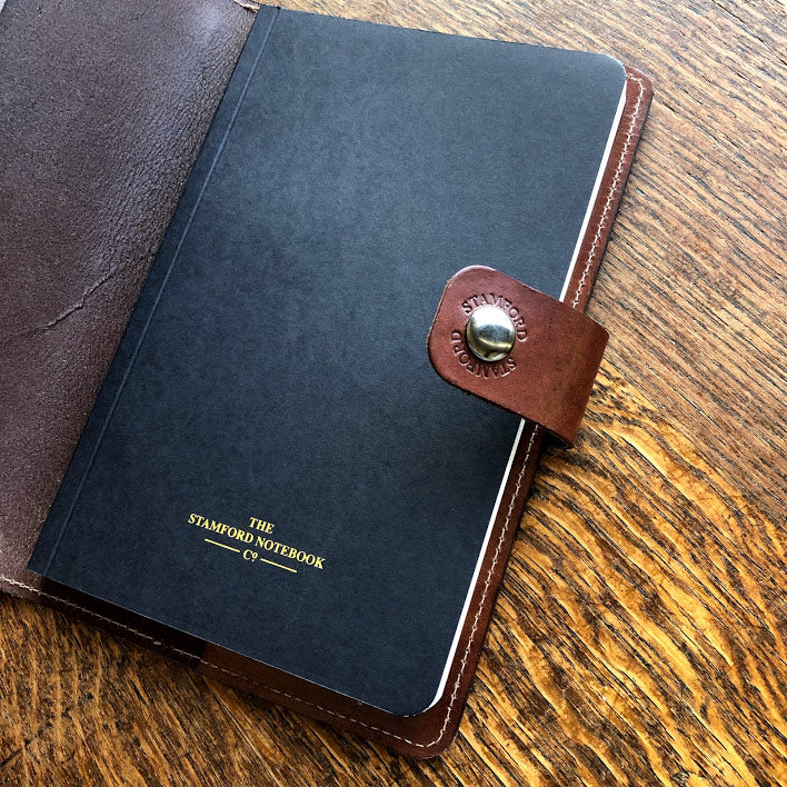 Open Burghley Leather Refillable Journal showing replaceable book