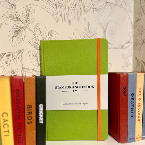 Lime Woven cloth hard cover notebook with orange trim. Hand bound using British made paper. Can personalise.