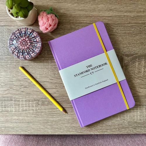 Violet Notebook with yellow trim. British made paper and handbound. can be personalised. Friends colours!